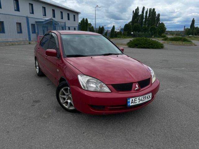Червоний Міцубісі Lancer, об'ємом двигуна 1.6 л та пробігом 210 тис. км за 3499 $, фото 1 на Automoto.ua