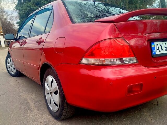 Красный Мицубиси Лансер, объемом двигателя 1.6 л и пробегом 174 тыс. км за 4700 $, фото 1 на Automoto.ua