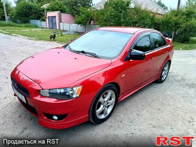 Червоний Міцубісі Lancer, об'ємом двигуна 2 л та пробігом 259 тис. км за 6500 $, фото 1 на Automoto.ua