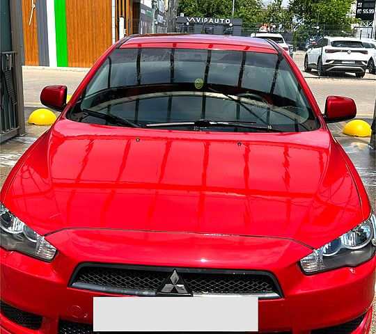 Красный Мицубиси Лансер, объемом двигателя 1.5 л и пробегом 145 тыс. км за 6500 $, фото 1 на Automoto.ua