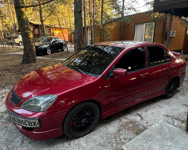 Червоний Міцубісі Lancer, об'ємом двигуна 2 л та пробігом 250 тис. км за 4500 $, фото 1 на Automoto.ua