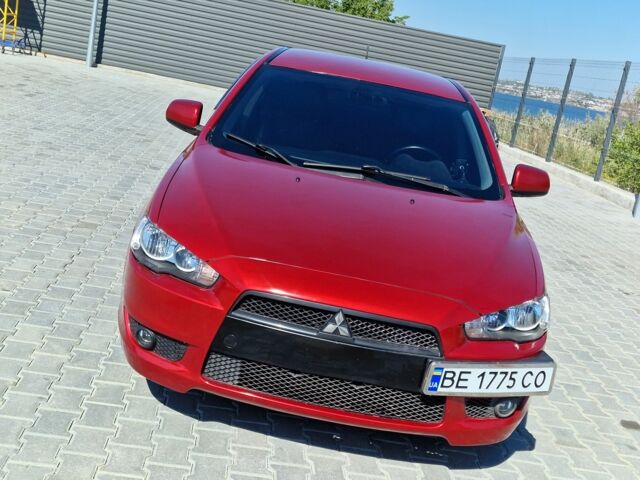 Красный Мицубиси Лансер, объемом двигателя 2 л и пробегом 274 тыс. км за 6000 $, фото 1 на Automoto.ua
