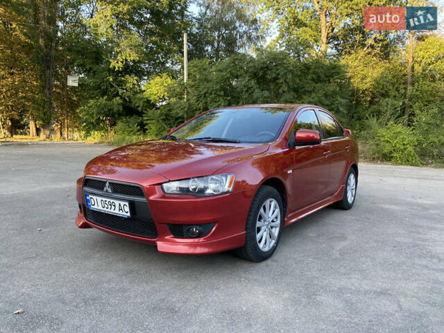 Червоний Міцубісі Lancer, об'ємом двигуна 2 л та пробігом 153 тис. км за 6700 $, фото 1 на Automoto.ua