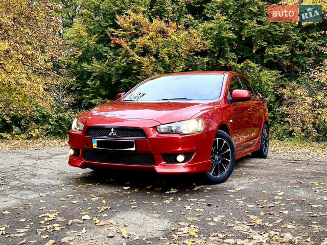 Червоний Міцубісі Lancer, об'ємом двигуна 2 л та пробігом 122 тис. км за 7200 $, фото 1 на Automoto.ua