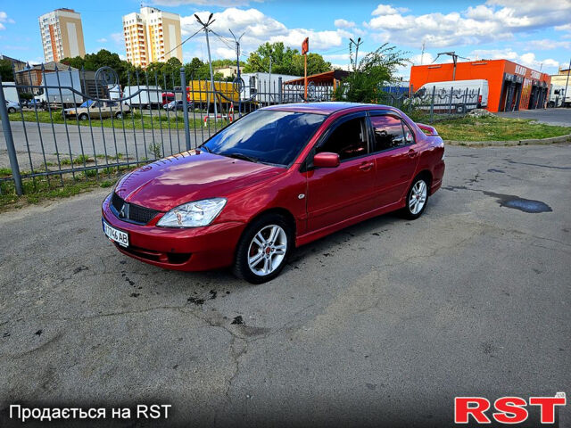 Красный Мицубиси Лансер, объемом двигателя 2 л и пробегом 271 тыс. км за 5500 $, фото 1 на Automoto.ua