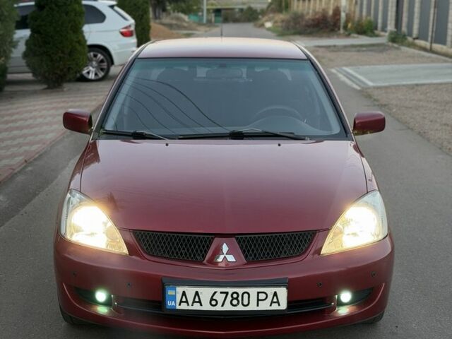 Червоний Міцубісі Lancer, об'ємом двигуна 1.6 л та пробігом 200 тис. км за 4010 $, фото 1 на Automoto.ua