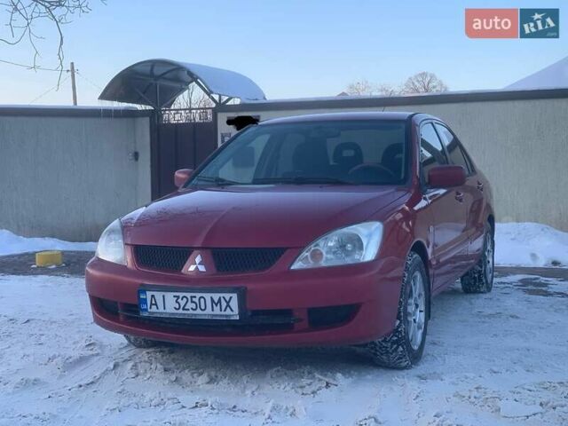 Червоний Міцубісі Lancer, об'ємом двигуна 1.58 л та пробігом 220 тис. км за 3650 $, фото 1 на Automoto.ua