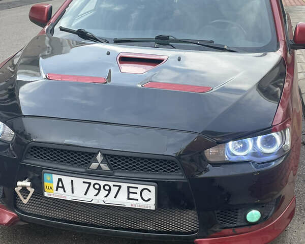 Красный Мицубиси Лансер, объемом двигателя 2 л и пробегом 275 тыс. км за 5500 $, фото 1 на Automoto.ua