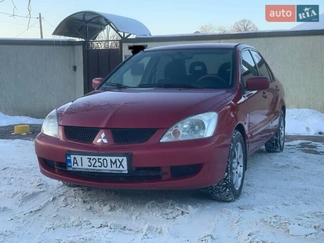 Червоний Міцубісі Lancer, об'ємом двигуна 1.58 л та пробігом 220 тис. км за 3850 $, фото 1 на Automoto.ua