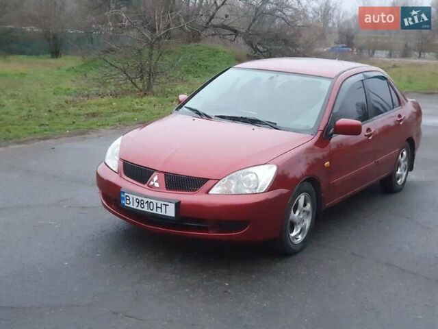 Красный Мицубиси Лансер, объемом двигателя 1.6 л и пробегом 250 тыс. км за 3700 $, фото 1 на Automoto.ua