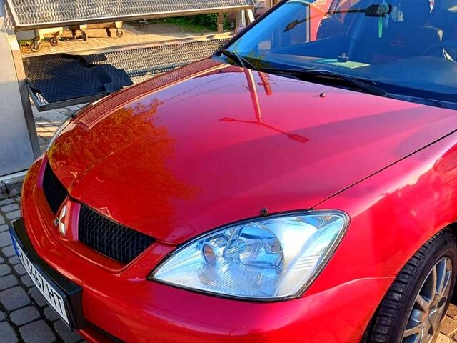 Красный Мицубиси Лансер, объемом двигателя 1.6 л и пробегом 311 тыс. км за 3550 $, фото 1 на Automoto.ua