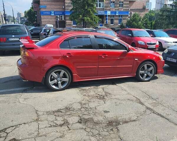 Червоний Міцубісі Lancer, об'ємом двигуна 2 л та пробігом 140 тис. км за 8500 $, фото 1 на Automoto.ua