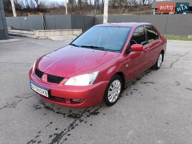 Червоний Міцубісі Lancer, об'ємом двигуна 1.58 л та пробігом 140 тис. км за 6000 $, фото 1 на Automoto.ua