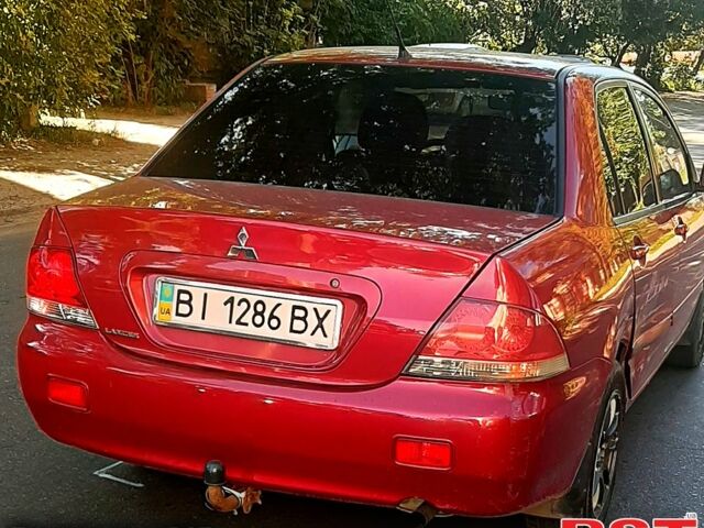 Червоний Міцубісі Lancer, об'ємом двигуна 1.6 л та пробігом 266 тис. км за 2900 $, фото 1 на Automoto.ua
