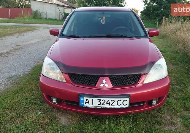 Красный Мицубиси Лансер, объемом двигателя 1.58 л и пробегом 198 тыс. км за 4650 $, фото 1 на Automoto.ua