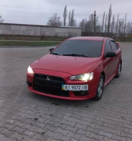 Красный Мицубиси Лансер, объемом двигателя 2 л и пробегом 200 тыс. км за 6000 $, фото 1 на Automoto.ua
