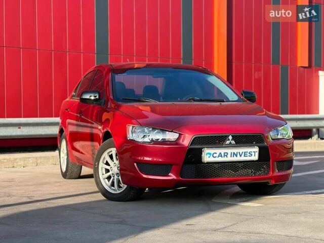 Красный Мицубиси Лансер, объемом двигателя 1.5 л и пробегом 235 тыс. км за 5800 $, фото 1 на Automoto.ua