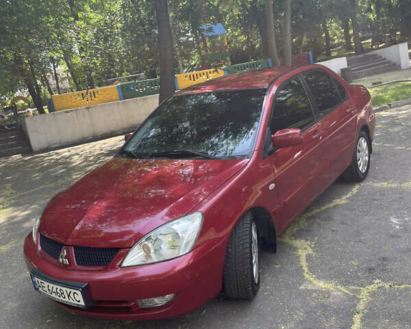 Червоний Міцубісі Lancer, об'ємом двигуна 1.6 л та пробігом 270 тис. км за 5699 $, фото 1 на Automoto.ua