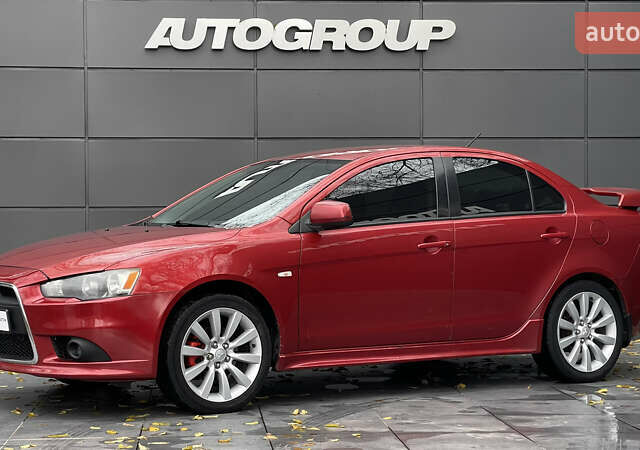 Червоний Міцубісі Lancer, об'ємом двигуна 2 л та пробігом 312 тис. км за 5700 $, фото 1 на Automoto.ua