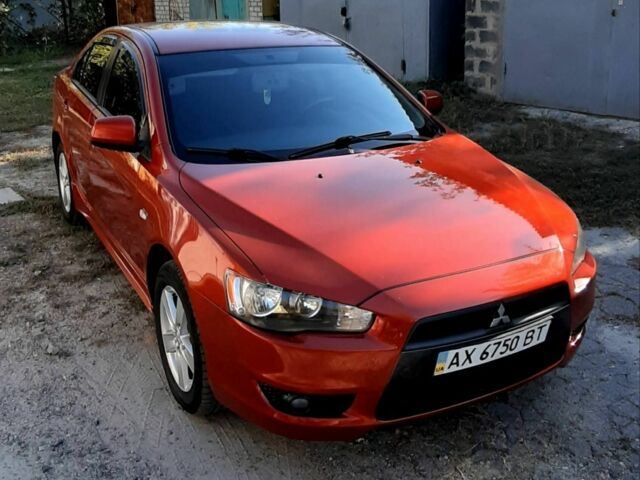 Красный Мицубиси Лансер, объемом двигателя 2 л и пробегом 110 тыс. км за 7500 $, фото 1 на Automoto.ua