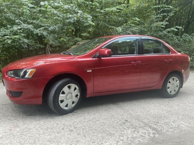 Красный Мицубиси Лансер, объемом двигателя 1.5 л и пробегом 124 тыс. км за 6300 $, фото 1 на Automoto.ua