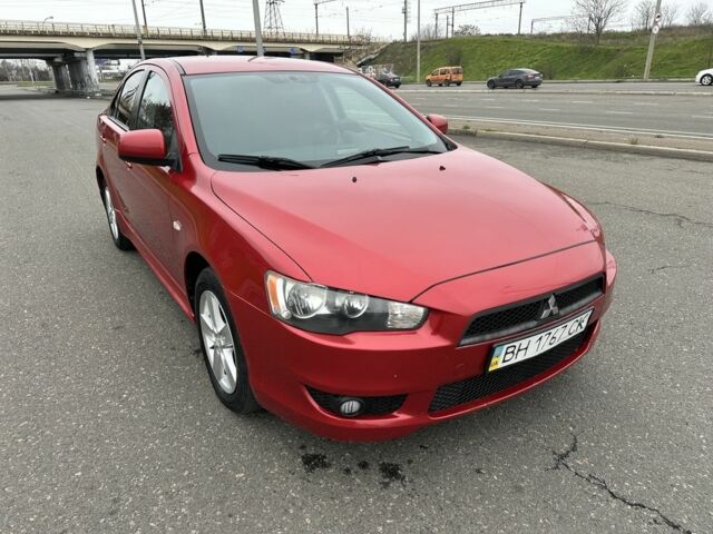 Красный Мицубиси Лансер, объемом двигателя 2 л и пробегом 366 тыс. км за 6500 $, фото 1 на Automoto.ua