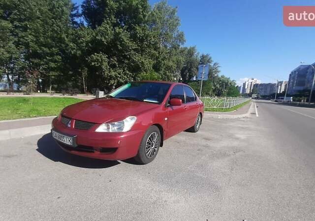 Червоний Міцубісі Lancer, об'ємом двигуна 1.6 л та пробігом 195 тис. км за 5500 $, фото 1 на Automoto.ua