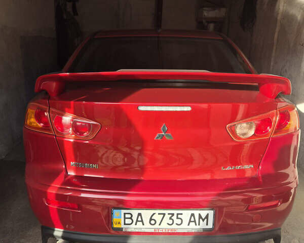 Красный Мицубиси Лансер, объемом двигателя 2 л и пробегом 65 тыс. км за 9300 $, фото 1 на Automoto.ua