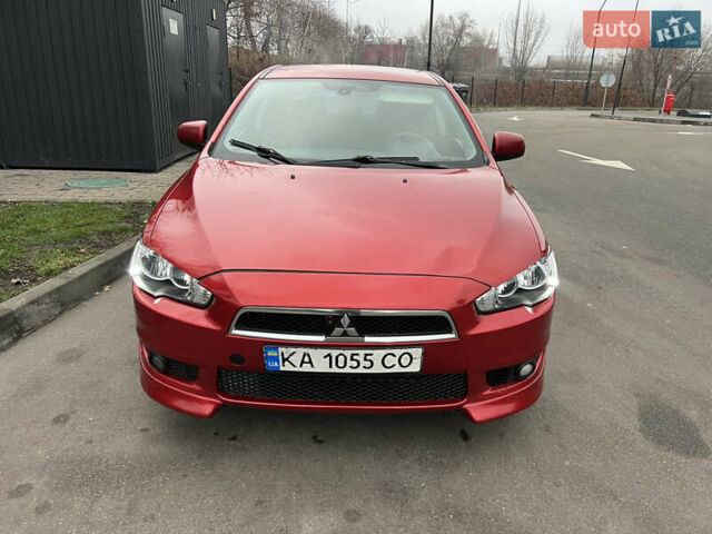 Красный Мицубиси Лансер, объемом двигателя 2 л и пробегом 330 тыс. км за 5250 $, фото 1 на Automoto.ua