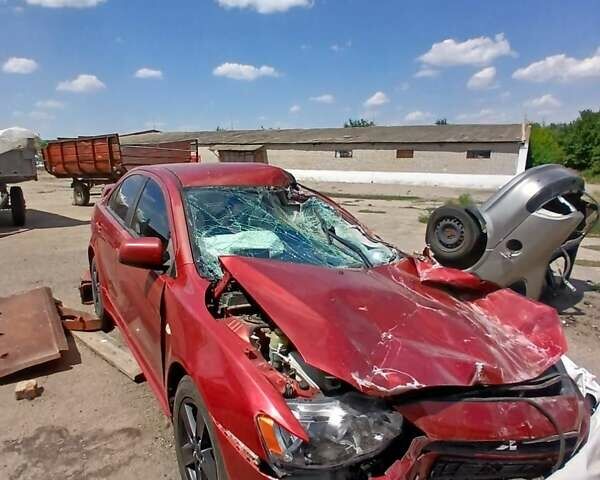 Красный Мицубиси Лансер, объемом двигателя 2 л и пробегом 192 тыс. км за 3000 $, фото 1 на Automoto.ua