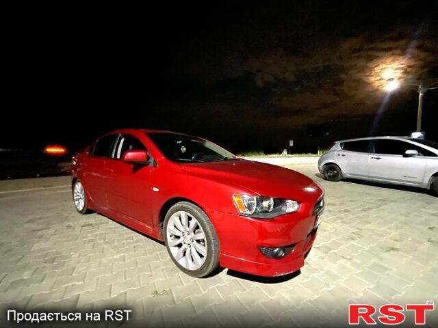 Червоний Міцубісі Lancer, об'ємом двигуна 2 л та пробігом 172 тис. км за 7000 $, фото 1 на Automoto.ua