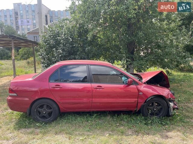 Червоний Міцубісі Lancer, об'ємом двигуна 1.58 л та пробігом 136 тис. км за 2500 $, фото 1 на Automoto.ua