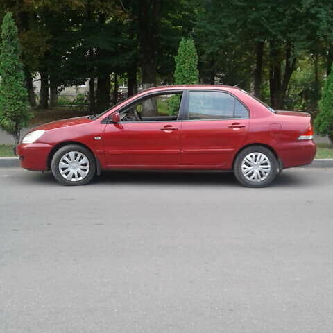 Красный Мицубиси Лансер, объемом двигателя 1.58 л и пробегом 230 тыс. км за 4700 $, фото 1 на Automoto.ua