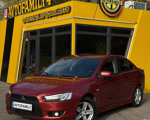 Червоний Міцубісі Lancer, об'ємом двигуна 2 л та пробігом 215 тис. км за 6500 $, фото 1 на Automoto.ua