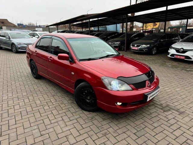 Красный Мицубиси Лансер, объемом двигателя 1.6 л и пробегом 215 тыс. км за 4500 $, фото 1 на Automoto.ua