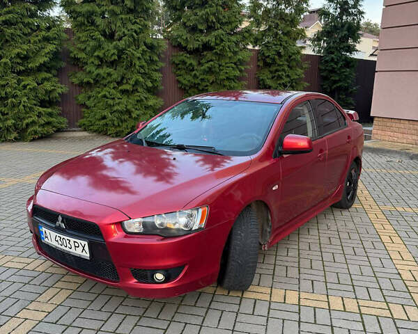 Красный Мицубиси Лансер, объемом двигателя 2 л и пробегом 143 тыс. км за 5200 $, фото 1 на Automoto.ua