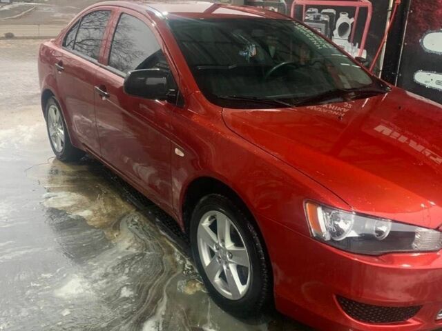 Красный Мицубиси Лансер, объемом двигателя 1.8 л и пробегом 205 тыс. км за 5800 $, фото 1 на Automoto.ua