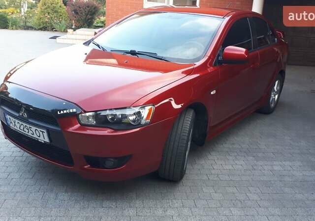 Червоний Міцубісі Lancer, об'ємом двигуна 2 л та пробігом 141 тис. км за 7600 $, фото 1 на Automoto.ua