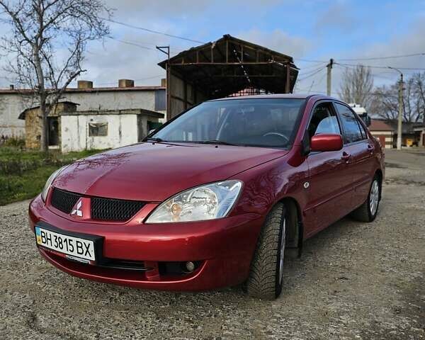 Червоний Міцубісі Lancer, об'ємом двигуна 1.6 л та пробігом 220 тис. км за 5800 $, фото 1 на Automoto.ua