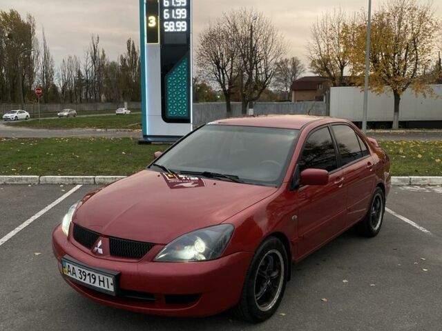 Червоний Міцубісі Lancer, об'ємом двигуна 1.6 л та пробігом 385 тис. км за 4500 $, фото 1 на Automoto.ua