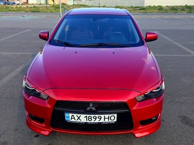 Красный Мицубиси Лансер, объемом двигателя 2 л и пробегом 185 тыс. км за 7500 $, фото 1 на Automoto.ua