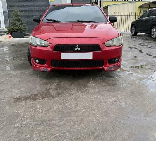 Красный Мицубиси Лансер, объемом двигателя 2 л и пробегом 240 тыс. км за 5000 $, фото 1 на Automoto.ua
