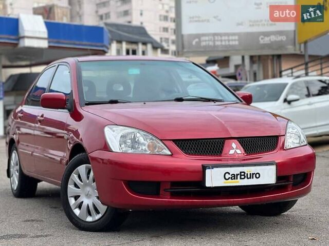 Червоний Міцубісі Lancer, об'ємом двигуна 1.58 л та пробігом 223 тис. км за 6400 $, фото 1 на Automoto.ua