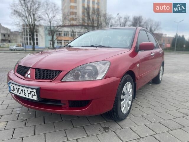 Красный Мицубиси Лансер, объемом двигателя 1.3 л и пробегом 222 тыс. км за 3700 $, фото 1 на Automoto.ua