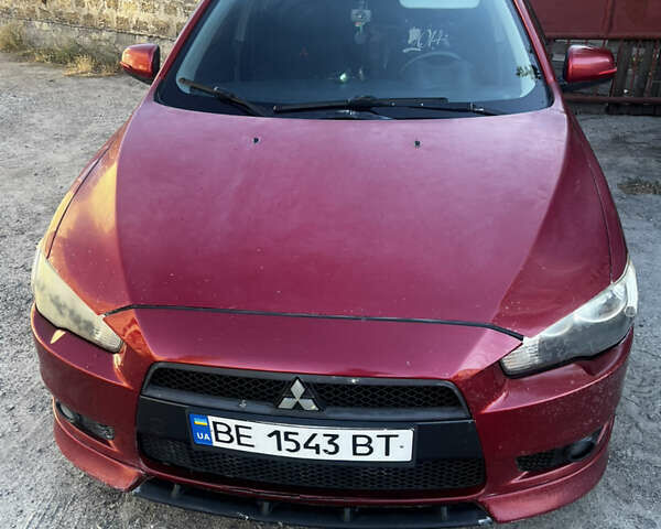 Красный Мицубиси Лансер, объемом двигателя 2 л и пробегом 242 тыс. км за 6500 $, фото 1 на Automoto.ua