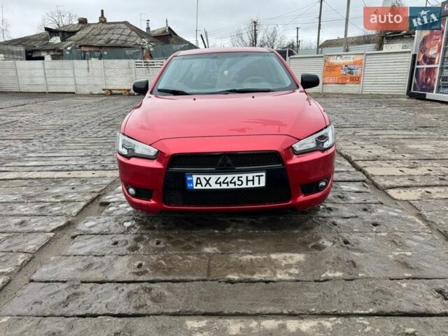 Красный Мицубиси Лансер, объемом двигателя 2 л и пробегом 299 тыс. км за 6500 $, фото 1 на Automoto.ua