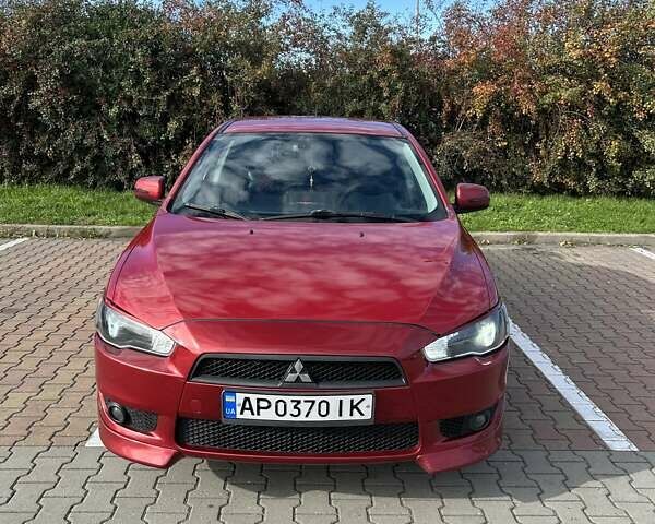 Красный Мицубиси Лансер, объемом двигателя 2 л и пробегом 227 тыс. км за 7000 $, фото 1 на Automoto.ua