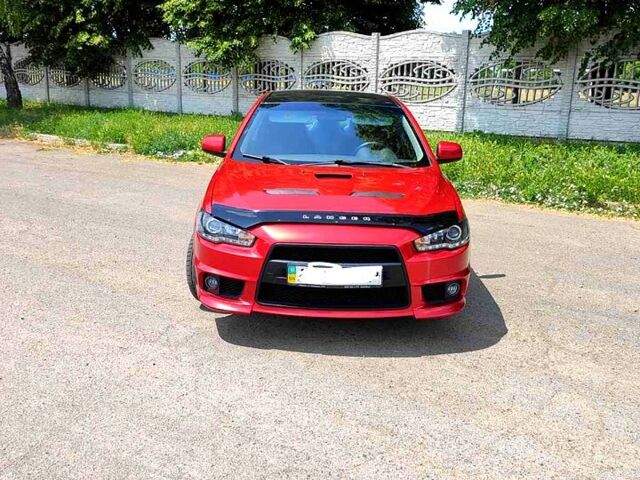 Красный Мицубиси Лансер, объемом двигателя 2 л и пробегом 300 тыс. км за 6200 $, фото 1 на Automoto.ua