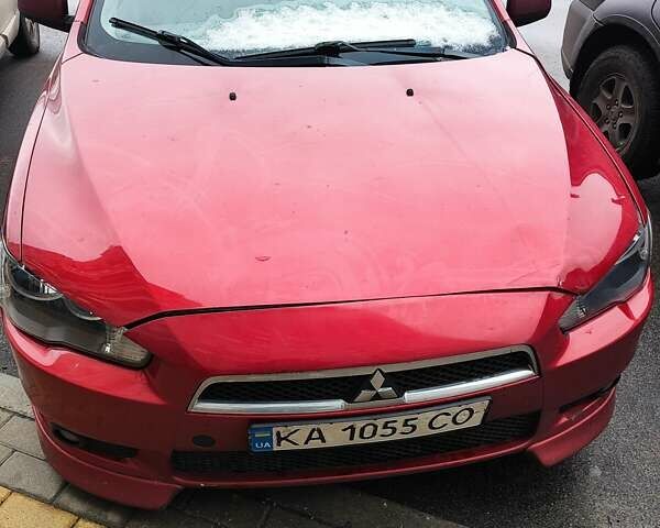 Красный Мицубиси Лансер, объемом двигателя 2 л и пробегом 330 тыс. км за 4500 $, фото 1 на Automoto.ua