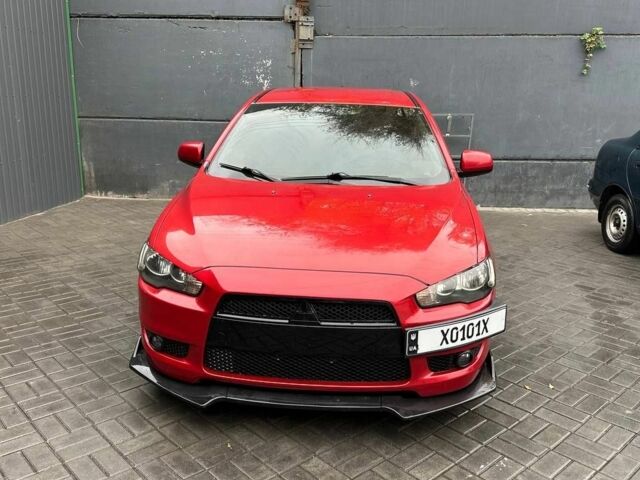 Червоний Міцубісі Lancer, об'ємом двигуна 2 л та пробігом 137 тис. км за 8500 $, фото 1 на Automoto.ua